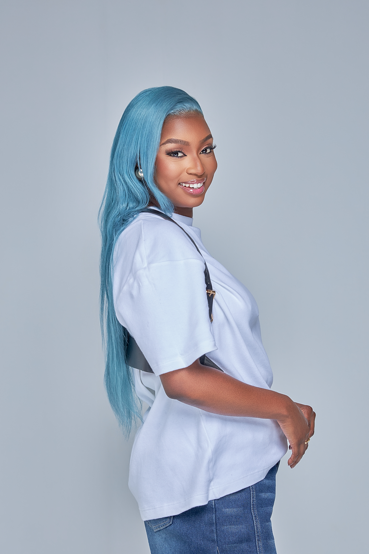 Musa Yende side profile with long blue hair